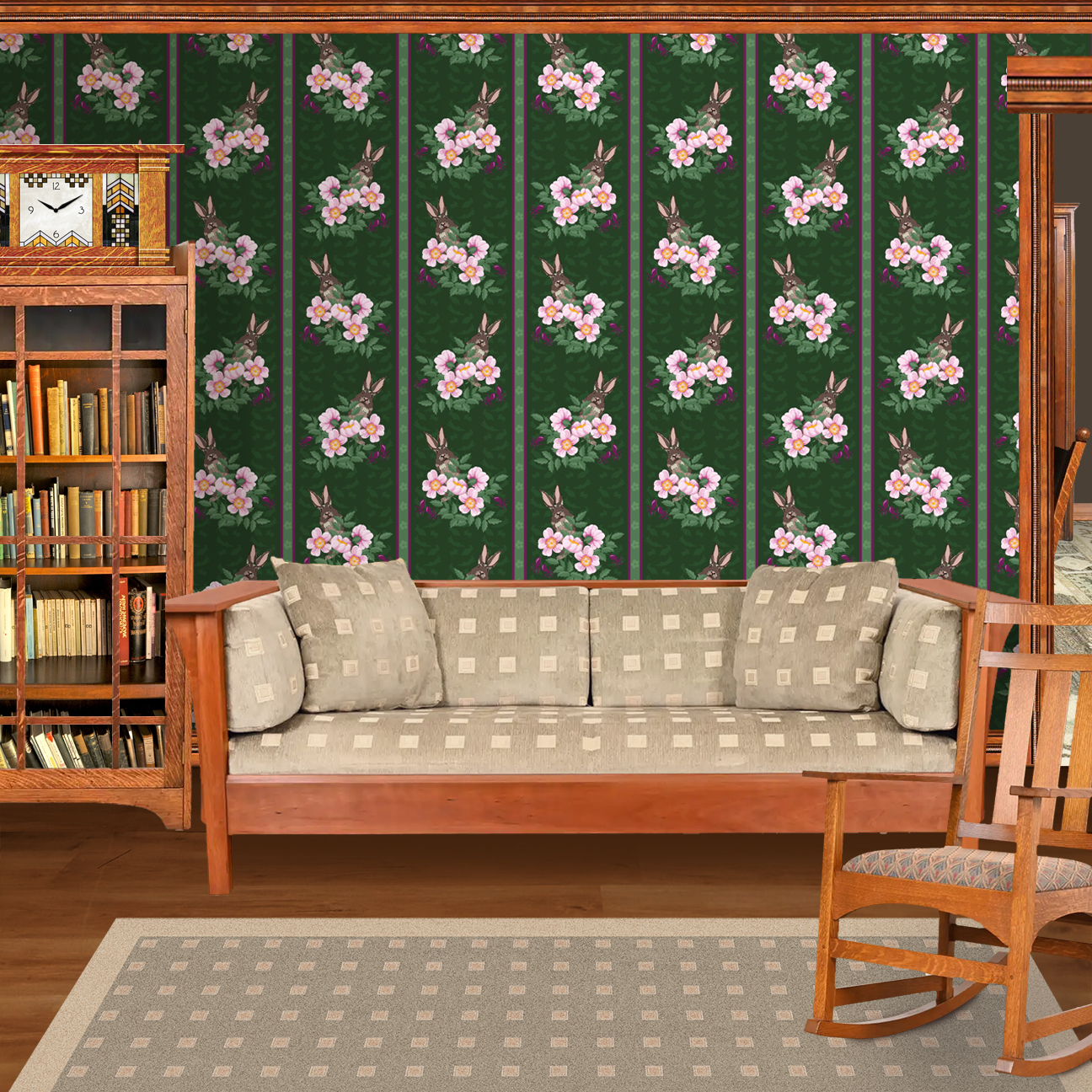 The artwork depicts a stylized brown hare partially concealed behind a cluster of green leaves and pink flowers with yellow centers. The background is dark green with subtle leafy patterns. Two vertical stripes—one dark purple and one green with small floral motifs—run along the left side, contrasting with the otherwise naturalistic elements. The composition balances the lively flora and fauna with a decorative, patterned design. The wallpaper design is shown in a Mission style living room